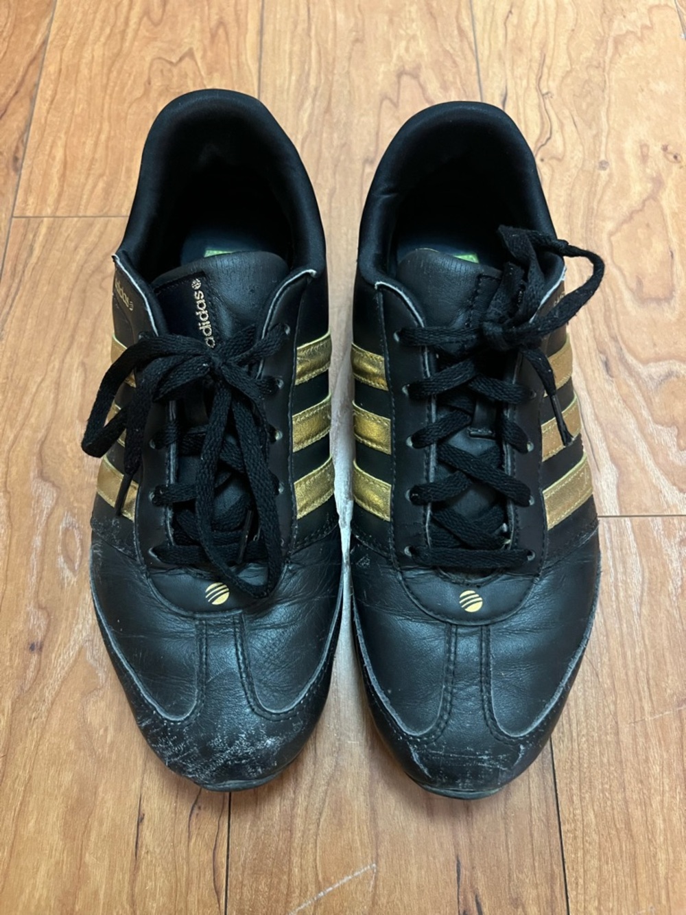 adidas Women's Black Sneakers with Gold Stripes